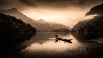 Ba be lake Vietnam fisherman